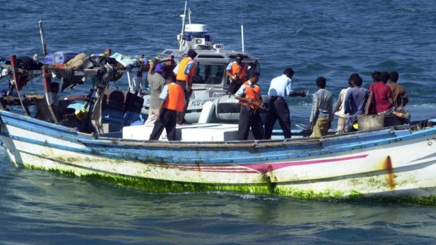 An undated picture shows Yemeni coast guards checking a small boat with refugees arriving from Somalia to the Yemeni port city Aden. According to the United Nations High Commissioner for Refugees (UNHCR) around 1,500 African refugees have made it to Yemeni shores after risky voyages in rough conditions to flee civil was in their country.