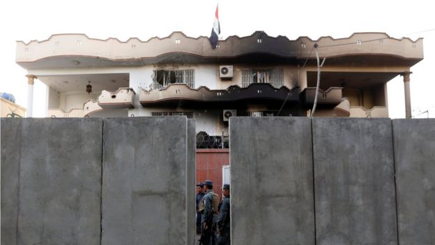 Afghan policemen inspect a building of the Iraqi embassy after an attack in Kabul, Afghanistan July 31, 2017