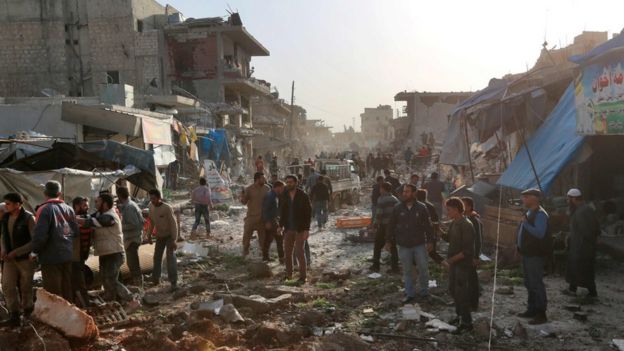 Aftermath of a reported air strike on a market in the rebel-held town of Atareb in northern Syria on 13 November 2017
