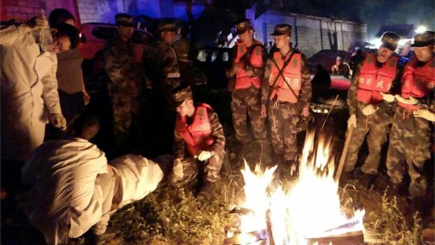 Medics treat a rescued person in Jiuzhaigou
