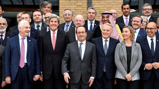 Left to right, front: Russian Ambassador to France Alexander Orlov, US Secretary of State John Kerry, French President Francois Hollande, French Foreign Minister Jean-Marc Ayrault, European Union Foreign Policy Chief Federica Mogherini, French State Secretary for European Affairs Harlem Desir and other foreign ministers and representatives gather for a group photo at the Middle East Peace Conference in Paris, France,