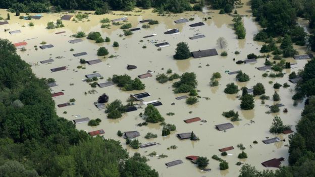 This file photo taken on 6 June 2013 shows an aerial view of summer houses flooded by water from the River Danube near the Bavarian village Deggendorf, southern Germany