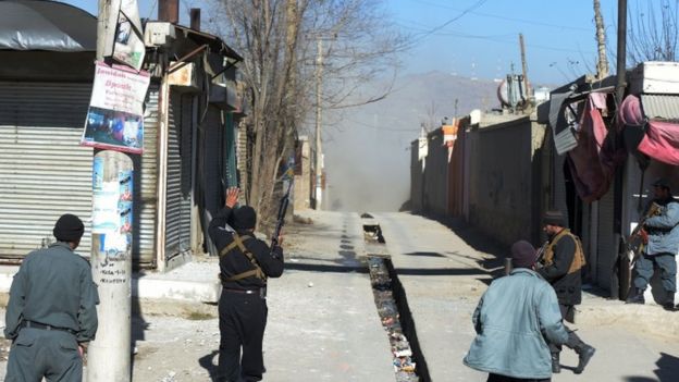Dust blows down a street after one of the explosions