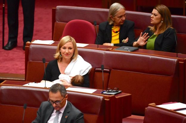 Senator Larissa Waters breastfeeds her daughter Alia Joy in Australian parliament.