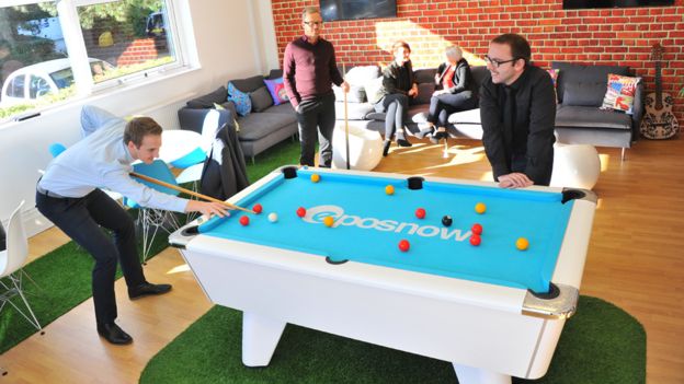 Staff playing pool