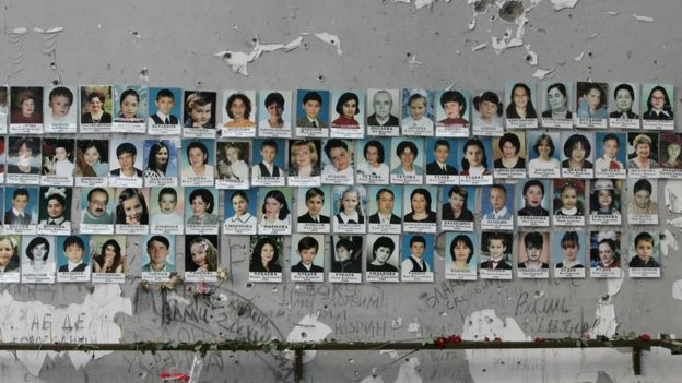 A picture made on 31 August 2005 shows portraits on the wall of school #1 of some of the victims of the Beslan crisis that erupted on 1 September, 2004