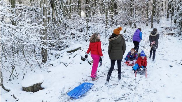 Children play in the snow in Newcastle-under-Lyme