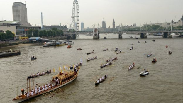 Royal barge Gloriana led a flotilla of boats down the River Thames