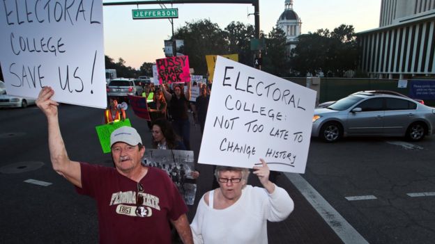 Protesters opposed to the electoral college circle the Capitol in Tallahassee, Florida, on 18 December 2016