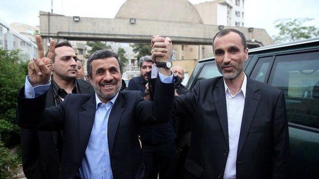 Mahmoud Ahmadinejad holds hands with former vice-president, Hamid Baghaei (12 April 2017)