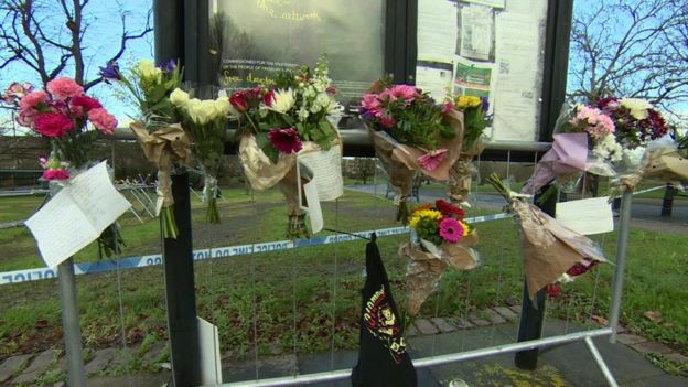Cards and flowers near the police cordon in Finsbury Park