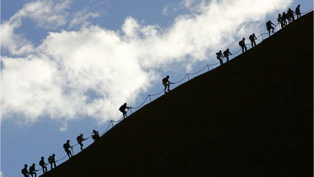 Tourists climbing Uluru in 2005