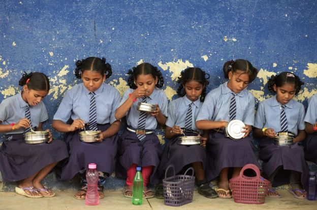 Indian school girls eating lunch