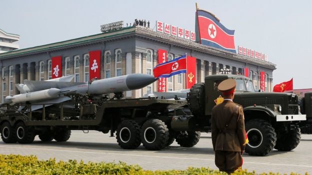 Missiles are driven past the stand with North Korean leader Kim Jong-un during a military parade marking the 105th birth anniversary of North Korea's founding father, Kim Il-sung, in Pyongyang, 15 April 2017