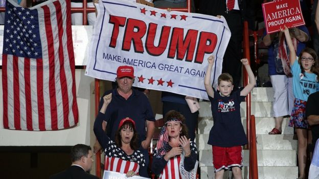 Supporters shout slogans and hold banners at a rally in Harrisburg, Pennsylvania (29 April)