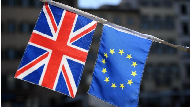 A UK flag appears next to a European Union flag