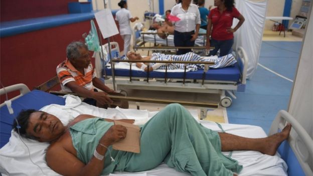 Injured people in hospital beds