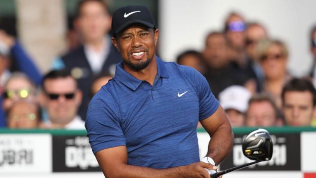 This file photo taken on February 1, 2017 shows Tiger Woods of the United States playing a shot during the Dubai Desert Classic golf tournament at the Emirates Golf Club in Dubai. Woods announced on his website on April 20, 2017, that he has undergone a fourth back surgery to alleviate pain, one that likely sidelines him at least until October. /