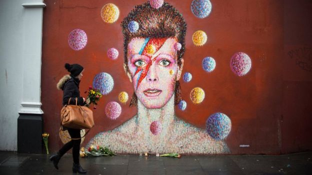 Flowers left for David Bowie at a mural to the singer in his birthplace of Brixton, south London