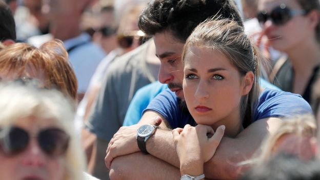 People observe the minute's silence on the Promenade des Anglais in Nice, southern France, 18 July