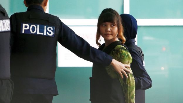 Vietnamese Doan Thi Huong who is on trial for the killing of Kim Jong Nam, the estranged half-brother of North Korea's leader, is escorted as she arrives at the Department of Chemistry in Petaling Jaya, near Kuala Lumpur, Malaysia October 9, 2017