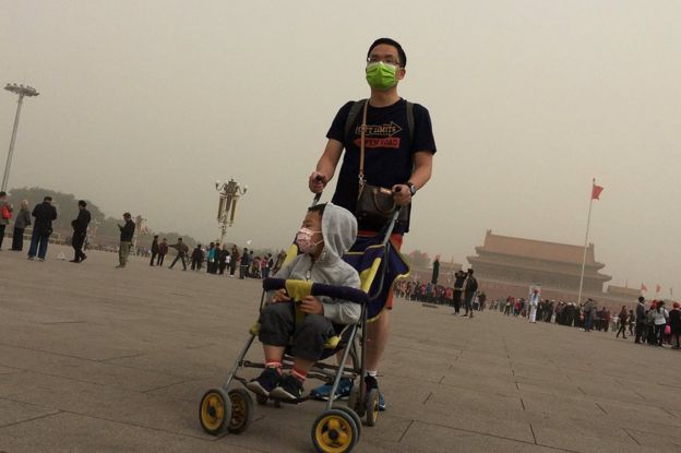 People visit Tiananmen Square as a dust storm hits Beijing, China 4 May 2017.