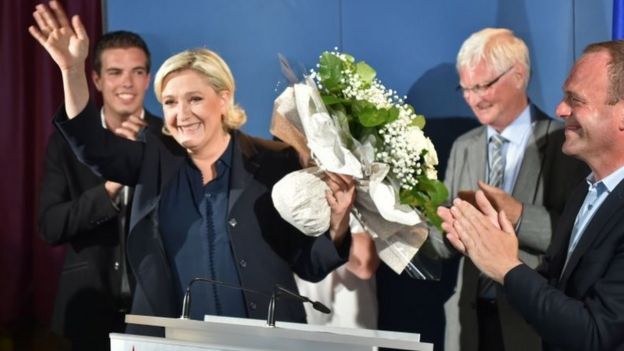 FN leader Marine Le Pen waves to her supporters in Henin-Beaumont on 18 June