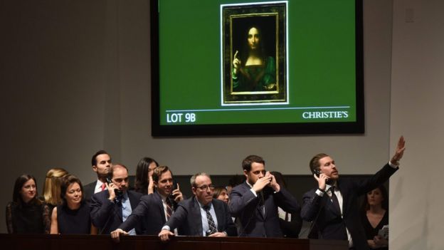 Christie's employees take bids for Salvator Mundi in New York November 15, 2017