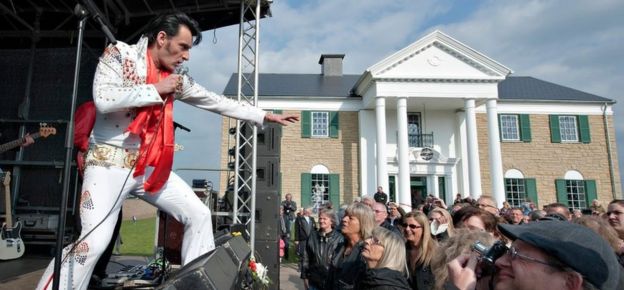 An Elvis impersonator plays outside Memphis Mansions in Denmark