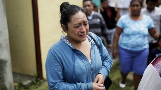 Relatives participate in a funeral of two victims of a mudslide in Santa Catarina Pinula, on the outskirts of Guatemala City, October 3, 2015.