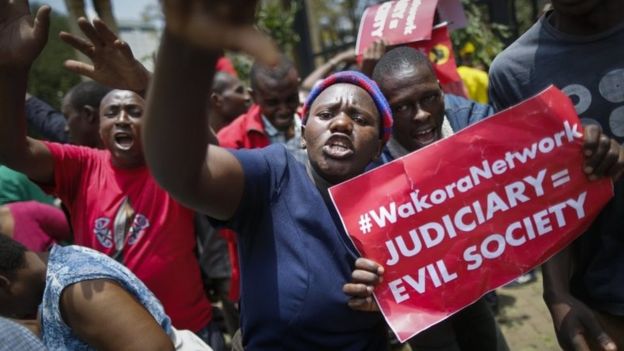 Supporters of the President Uhuru Kenyatta and his Jubilee party shout slogans to protest against the Supreme Court in downtown Nairobi, Kenya, 19 September 2017