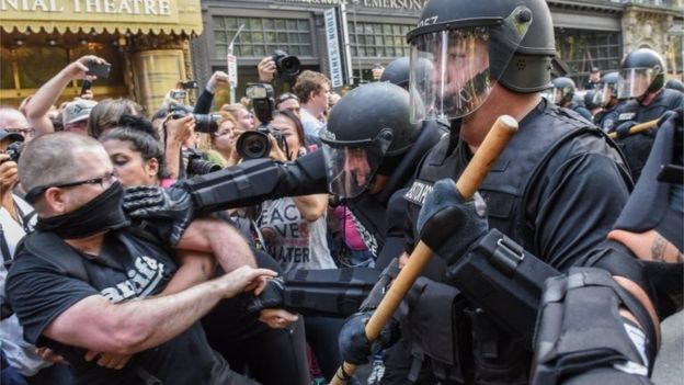 Police in Boston clash with protesters against a conservative rally, 19 August 2017