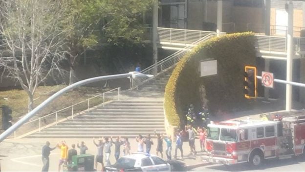 People gather outside a building following a shooting at the headquarters of YouTube, in San Bruno, California, U.S., April 3, 2018 in this picture obtained from social media.