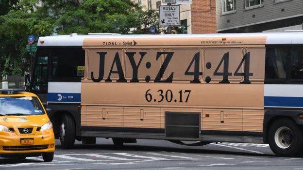 A bus with an advertisement for Jay-Z's anticipated new album '4:44' turns a corner in midtown New York City