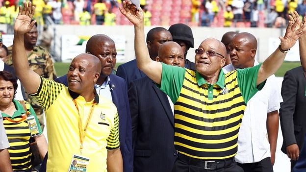 South African president and African National Congress (ANC)'s president Jacob Zuma (R) waves at supporters as he arrives for the Party official launch of the Municipal Elections manifesto on April 16, 2016 in Port Elizabeth, South Africa