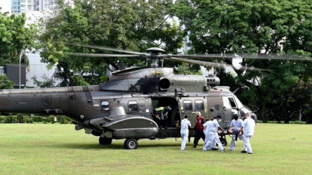 A Singapore Air Force helicopter transports wounded to hospital
