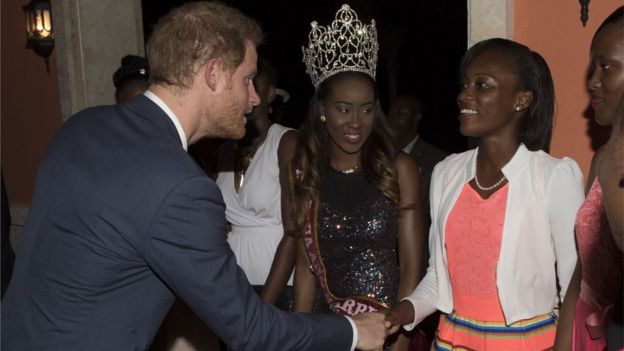Prince Harry shakes hands with guest