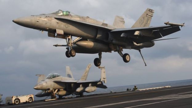 An F/A-18 fighter lands on the deck of the Nimitz-class aircraft carrier USS Carl Vinson during a South Korea-US joint military cxercise in seas east of the Korean Peninsula on 14 March 2017.