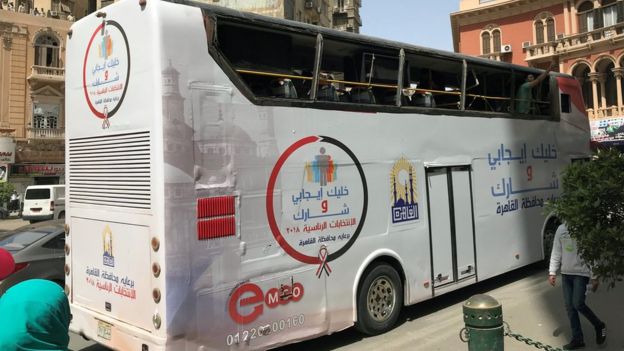 A bus, with the words reading "Be positive and come to vote", tours the city and calls on citizens to participate in the presidential election in Cairo, Egypt March 25, 2018.