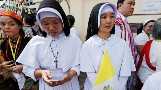 Nuns wait outside the residence of Cardinal Charles Maung Bo, Archbishop of Yangon, where Pope Francis will be staying during his visit in Yangon, Myanmar on 27 November 2017
