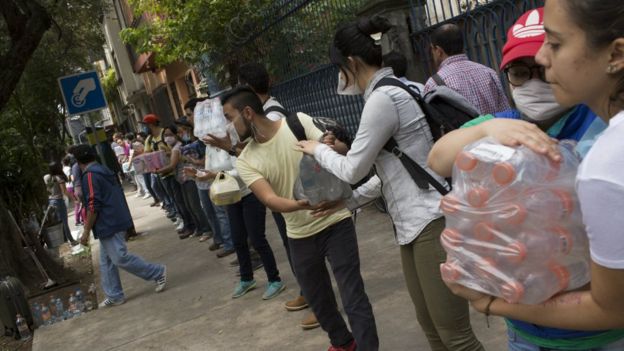 People help distribute supplies at Parque Mexico on September 20, 2017 in Mexico City