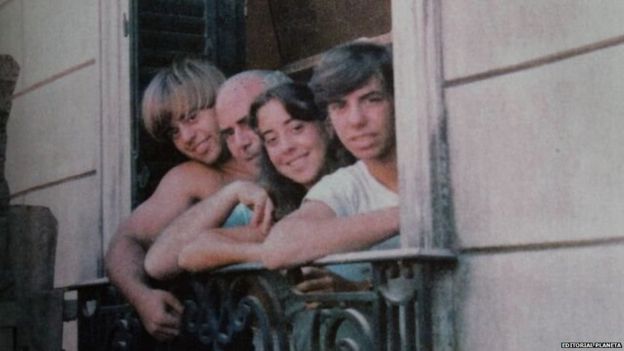 Daniel, Arquimedes, Silvia and Guillermo Puccio look from a window in this undated file photo