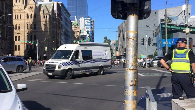 Police on Flinders Street after a car hit pedestrians, 21 December 2017