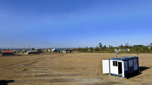 Shipping containers with a satelite dish on top