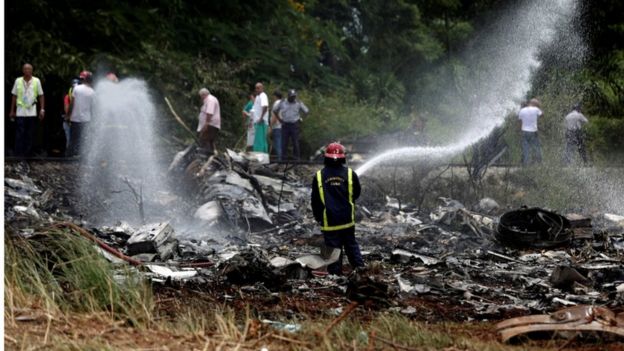Firefighter and wreckage of the Boeing-737 that crashed shortly after take off from Jose Marti International Airport in Havana, Cuba, 18 May 2018
