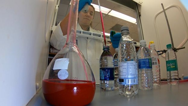 Testing bottlesPlastic particles bottled water 