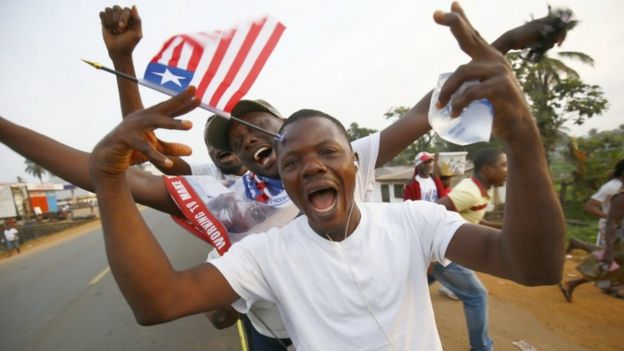 Liberians cheer as they stand in line to enter the inauguration off the President-elect, George Weah, at the Samuel Kanyon Doe stadium, in Monrovia, Liberia, 22 January 2018.