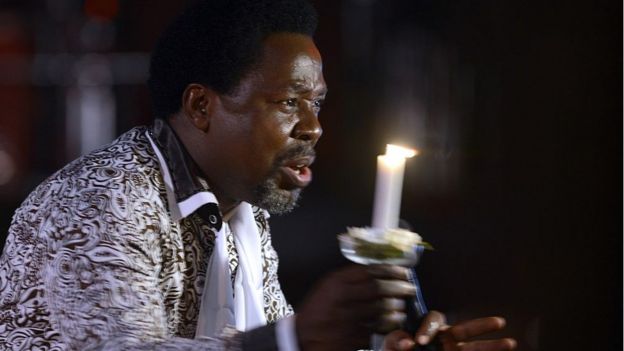 Nigerian pastor TB Joshua speaks during a New Year's memorial service for the South African relatives of those killed in a building collapse at his Lagos megachurch on December 31, 2014