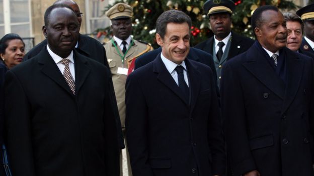 Former French President Nicolas Sarkozy with two African heads of state