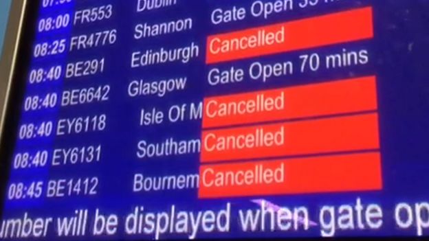 Departure board at Manchester airport showing cancellations